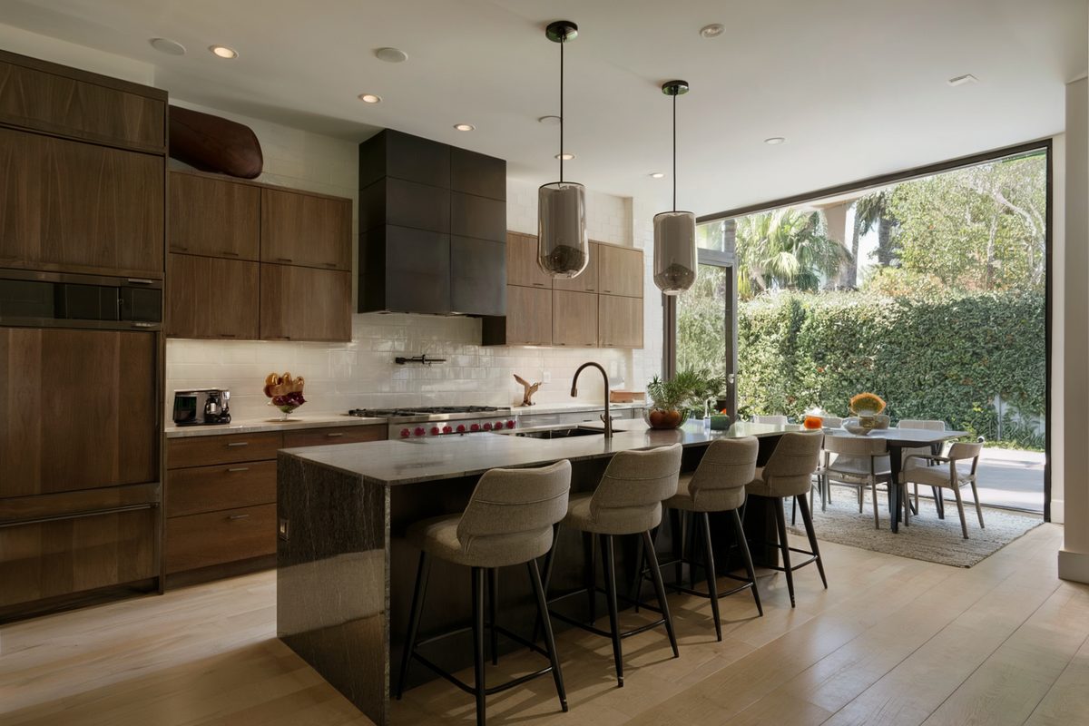 Modern kitchen remodel with a large glass wall in a Beverly Hills home